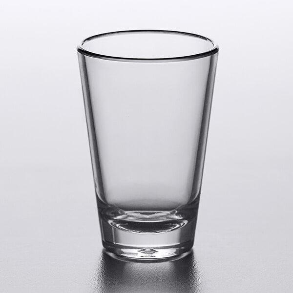 A clear Carlisle SAN plastic dessert shot glass.