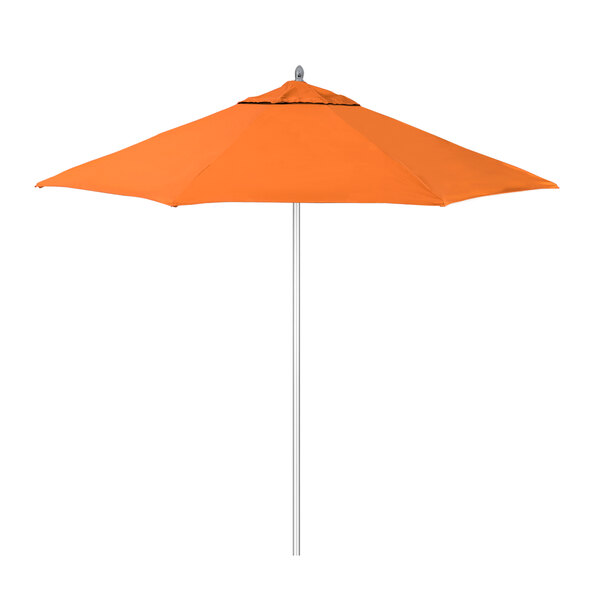 An orange California Umbrella with a Sunbrella Tuscan canopy and white pole.