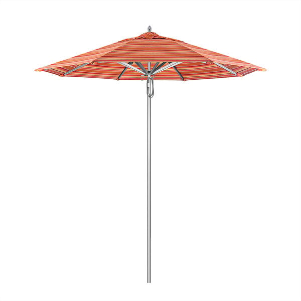 A California Umbrella with orange and white striped Sunbrella canopy on a metal pole.