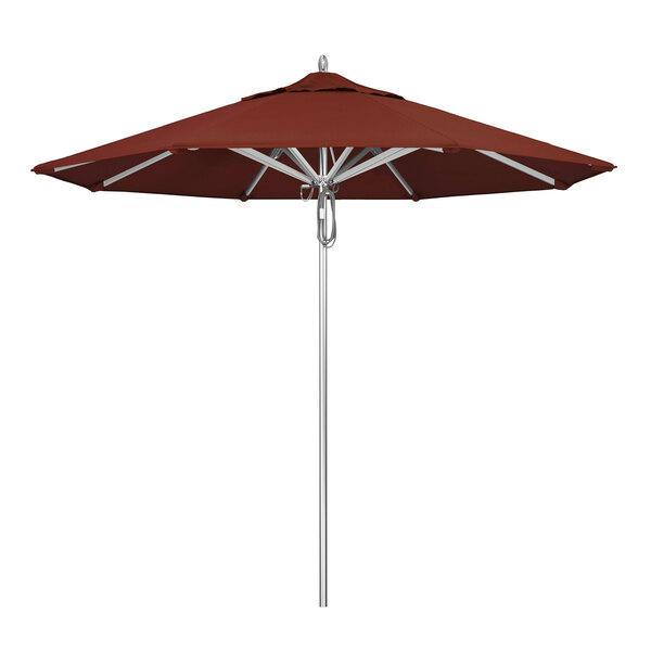 A California Umbrella with a red Sunbrella canopy on a pole.