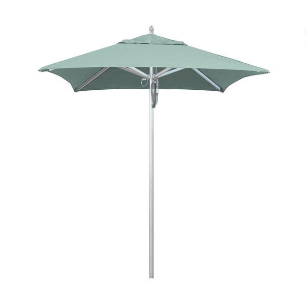 A close-up of a green California Umbrella on a metal pole.
