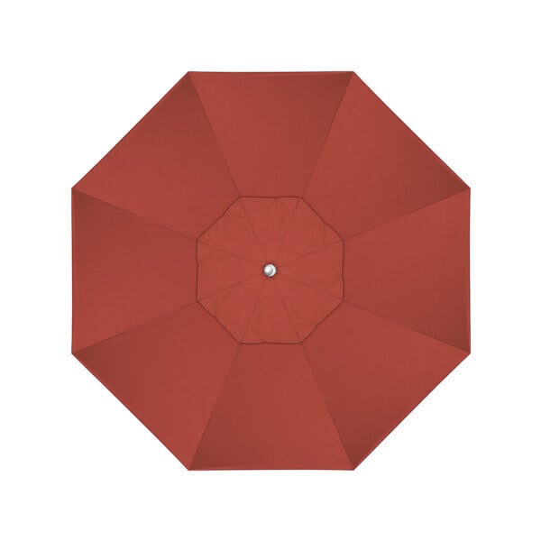 A top view of a red California Umbrella with a silver button and a terracotta canopy.