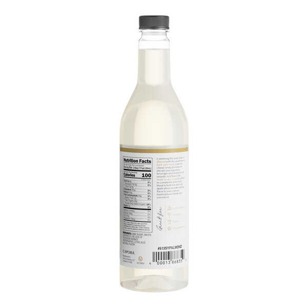 A white bottle of Capora Almond Flavoring Syrup with a label.