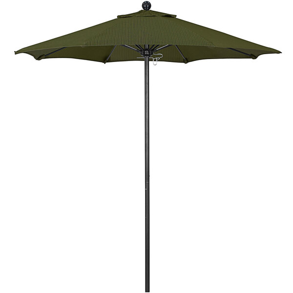 A green California Umbrella with a black pole on a terrace fern background.