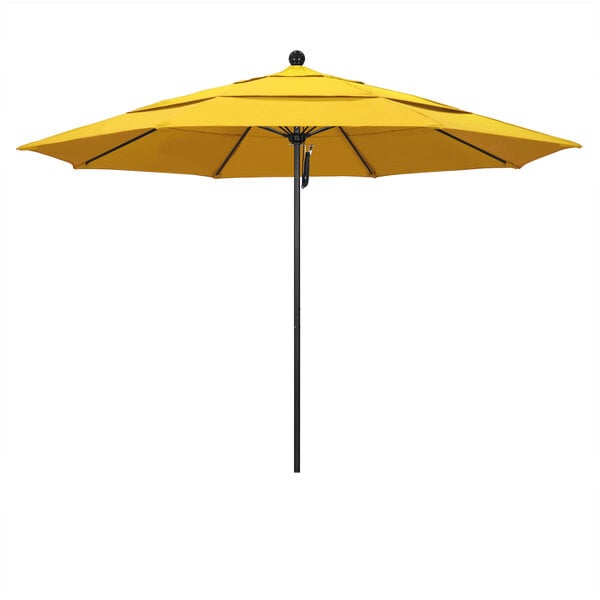 A California Umbrella lemon yellow umbrella on a black pole.