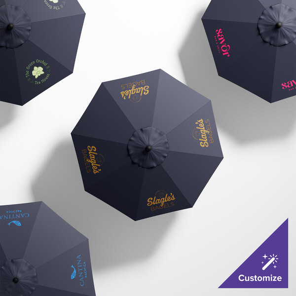 A close-up of a navy blue California Umbrella with a round Sunbrella canopy.