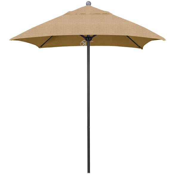 A tan California Umbrella on a black pole.