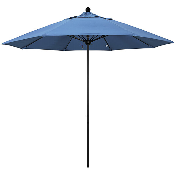 A frost blue California Umbrella with a black pole.