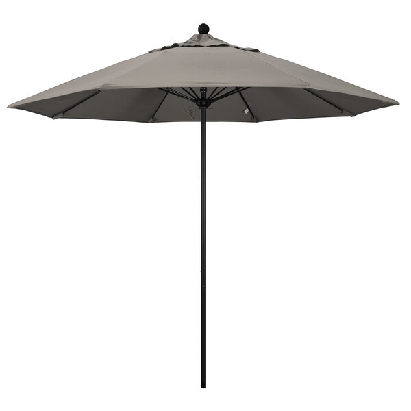 A California Umbrella ALTO round outdoor umbrella with a grey canopy and black pole.