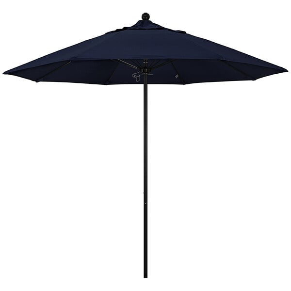 A navy blue California Umbrella with a black pole.