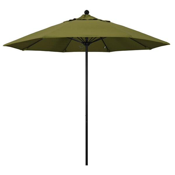 A green California Umbrella on a black pole.