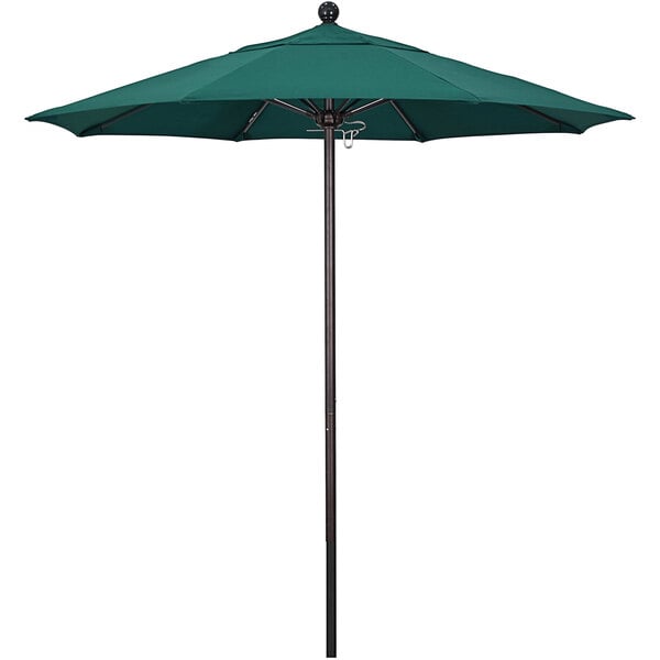 a green umbrella with a ball on top
