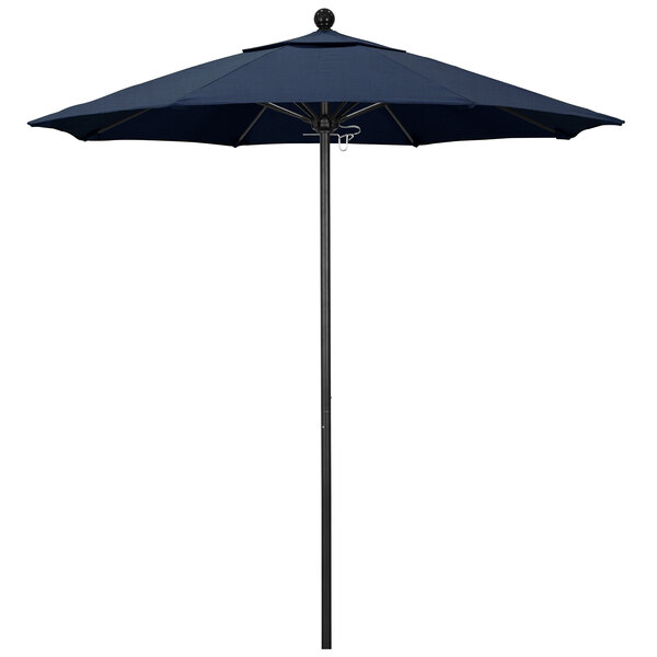 A California Umbrella with a blue sunbrella and black pole.