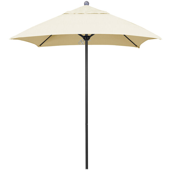 A white California Umbrella on a black pole.