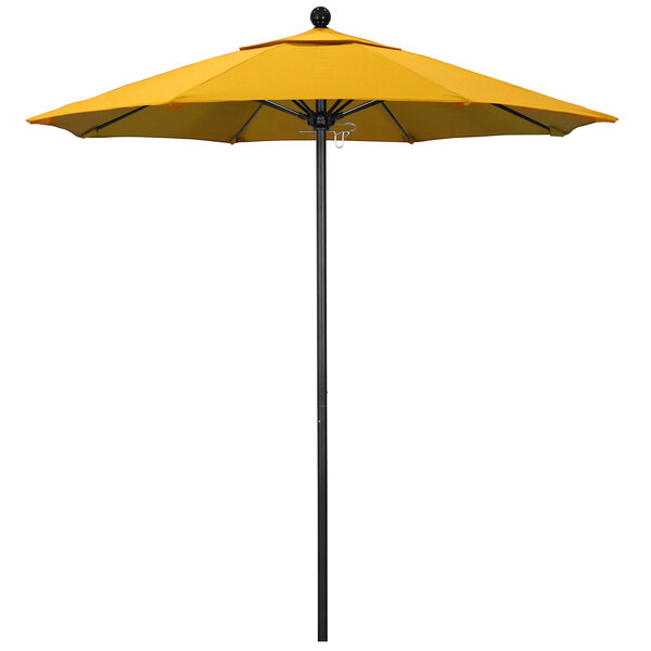 A close up of a California Umbrella with Sunflower Yellow Sunbrella canopy on a black pole.