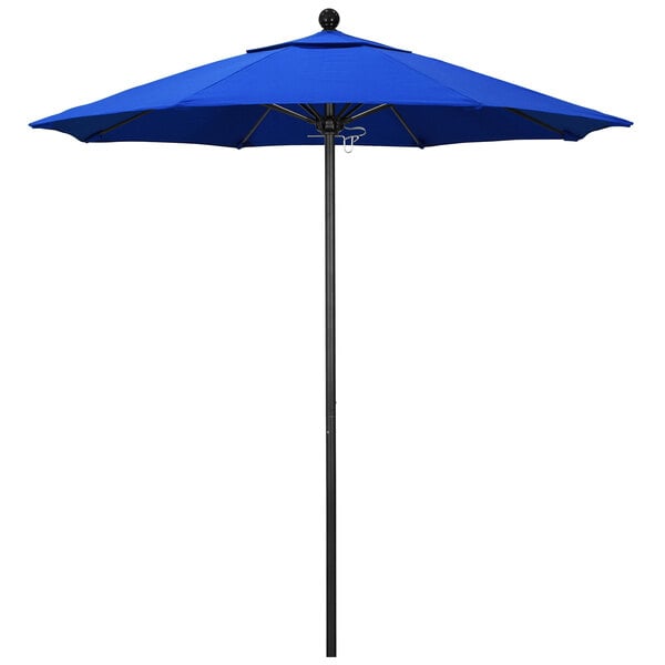 A blue California Umbrella on a black pole.