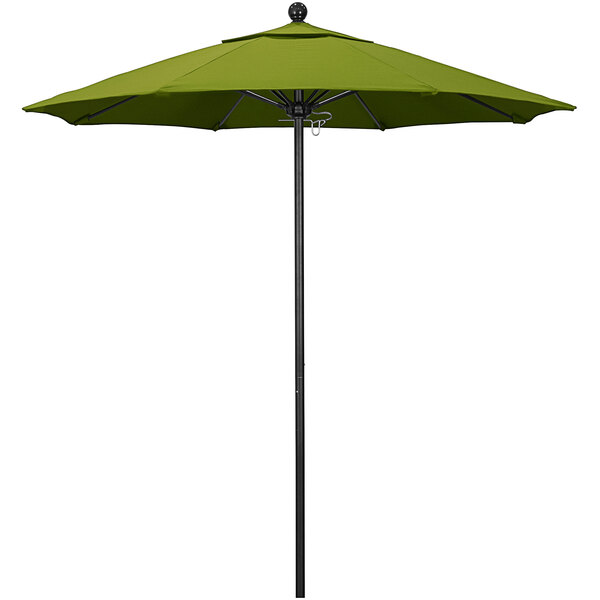 A green California Umbrella on a black pole.