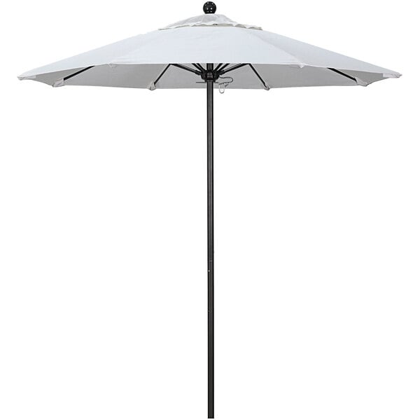 A white California Umbrella with a black pole.