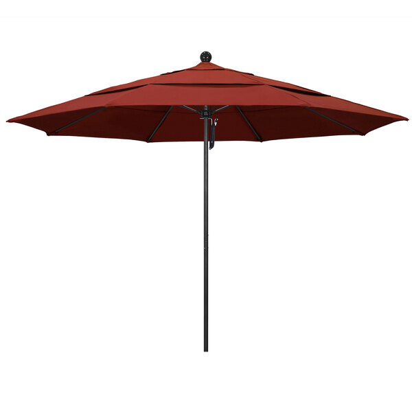 A red California Umbrella on a black pole.