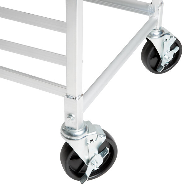 A metal frame for sheet pan racks with black swivel stem casters.