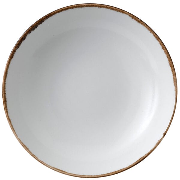 A Dudson Harvest china bowl with a brown rim on a white surface.