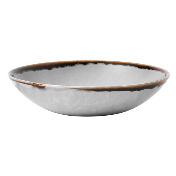 A white bowl with a brown rim.