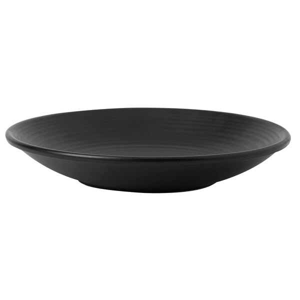 A matte jet black Dudson stoneware plate on a table.