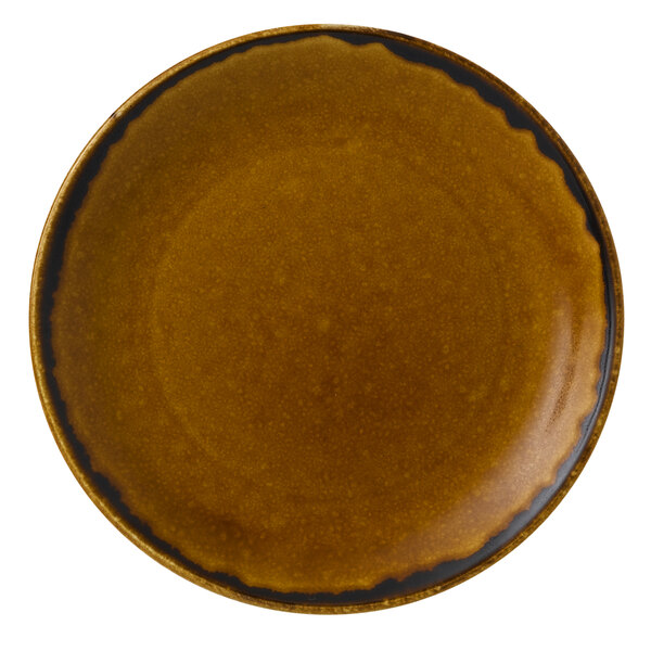 A close-up of a brown Dudson Harvest china plate with black trim.