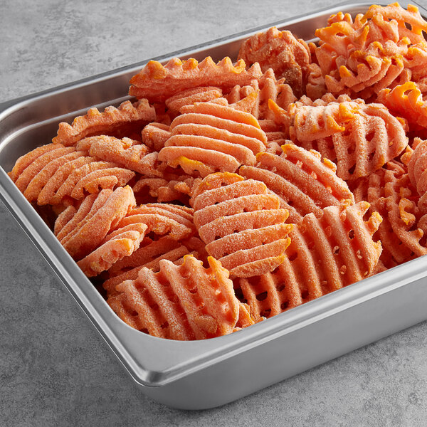 A container of McCain Harvest Splendor Sweet Potato Cross Trax Waffle Fries.