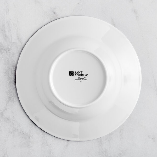 A Sant'Andrea Francia bright white porcelain pasta bowl with an embossed design on the rim.
