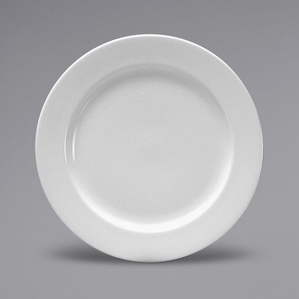 A close-up of a white Sant'Andrea Montague bone china plate with a medium rim.