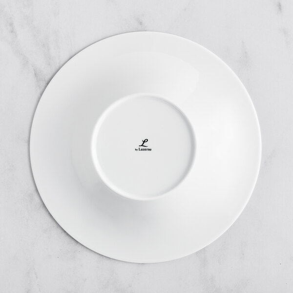 A Sant'Andrea Francia bright white porcelain bowl with an embossed design on the rim.