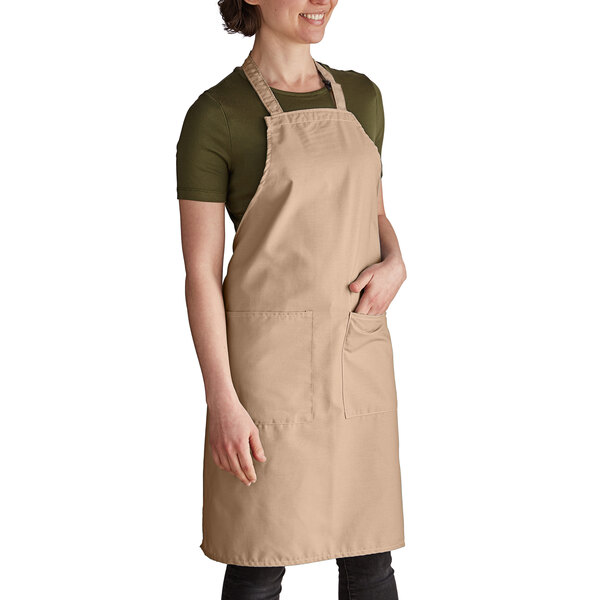 a woman wearing a brown apron