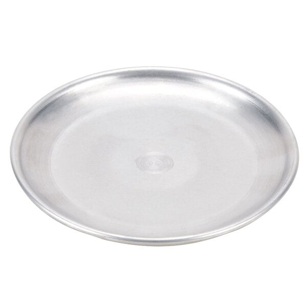 An American Metalcraft aluminum pizza pan with a circle in the middle on a white surface.