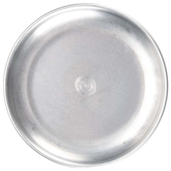 An American Metalcraft aluminum coupe pizza pan with a white circle and a circle in the middle.