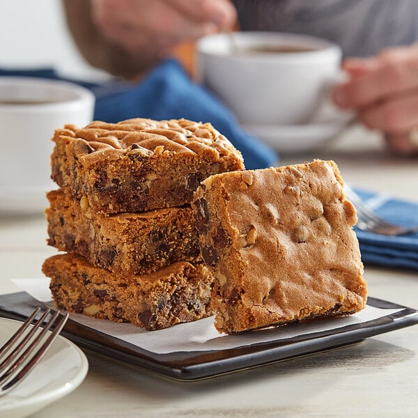 A stack of David's Cookies blondie brownies on a plate.