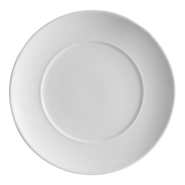 A bright white porcelain plate with embossed lines and a wide rim.
