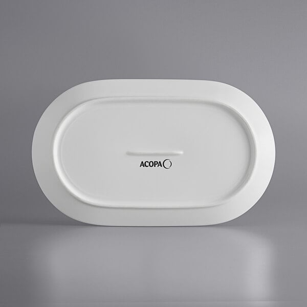 A white rectangular Acopa Liana porcelain platter with embossed lines.