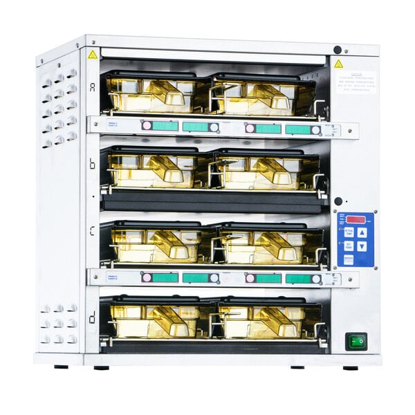 A white and gold Prince Castle Dual-Sided holding bin with trays on the shelves.