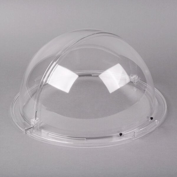 A clear plastic round cover with black dots.