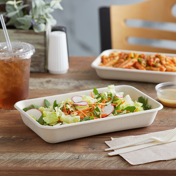 a salad in a white container