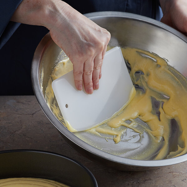 a person mixing food in a bowl