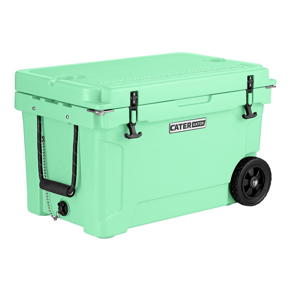 A seafoam green CaterGator outdoor cooler with black wheels and handles.