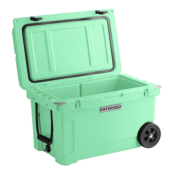 A seafoam green CaterGator outdoor cooler with wheels.