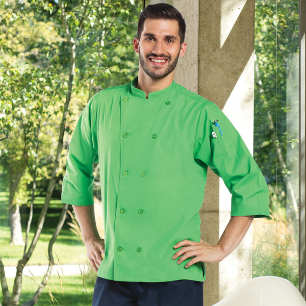 A man wearing a lime green Uncommon Chef 3/4 sleeve chef coat.