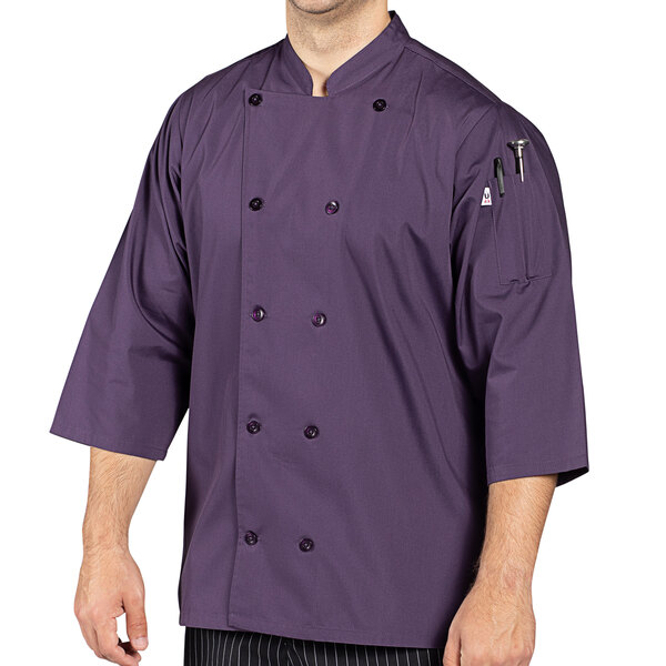 A man wearing an Uncommon Chef eggplant 3/4 length sleeve chef coat.