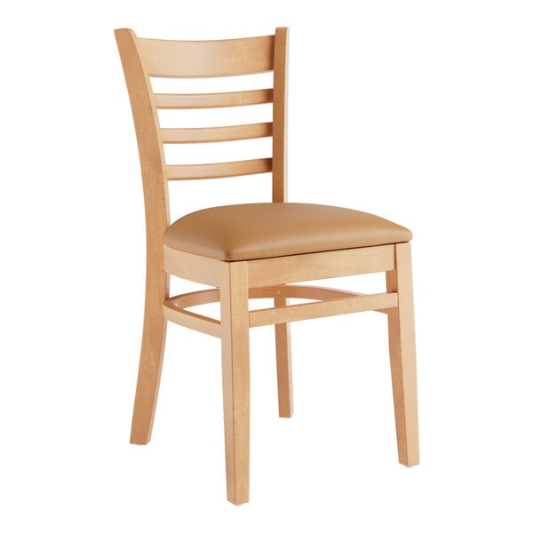 A Lancaster Table & Seating wooden restaurant chair with a light brown cushion on the seat and ladder back.