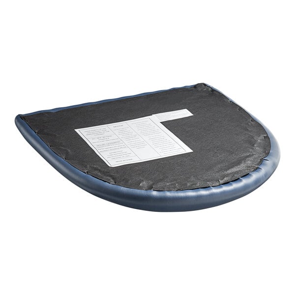 A navy vinyl cushion on a wood chair with a piece of paper on it.