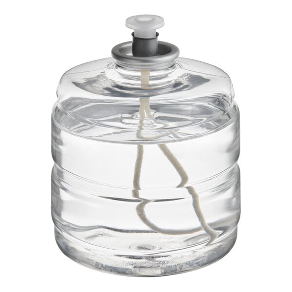 A clear liquid candle fuel cartridge with a visible wick and a plastic cap.