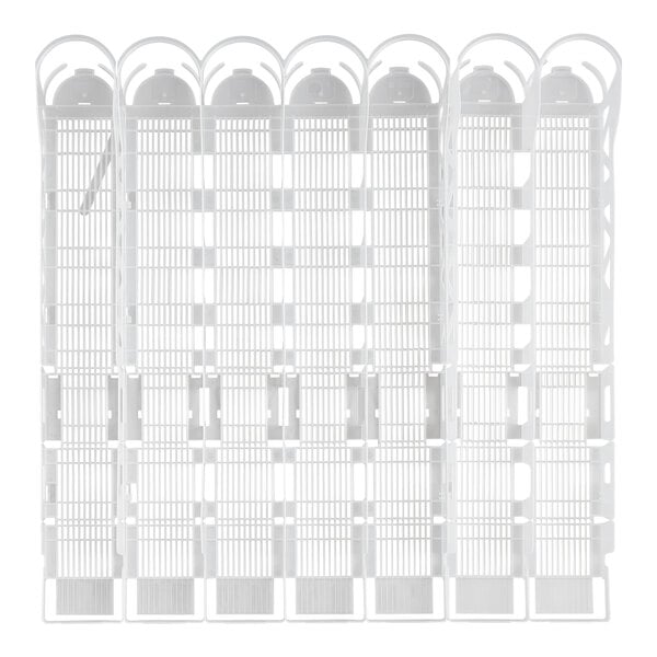 A white plastic tray with 7 lanes of holes for bottles.